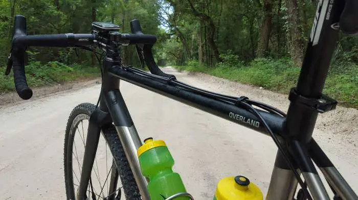 One of the final dirt roads. Top tube glistening...