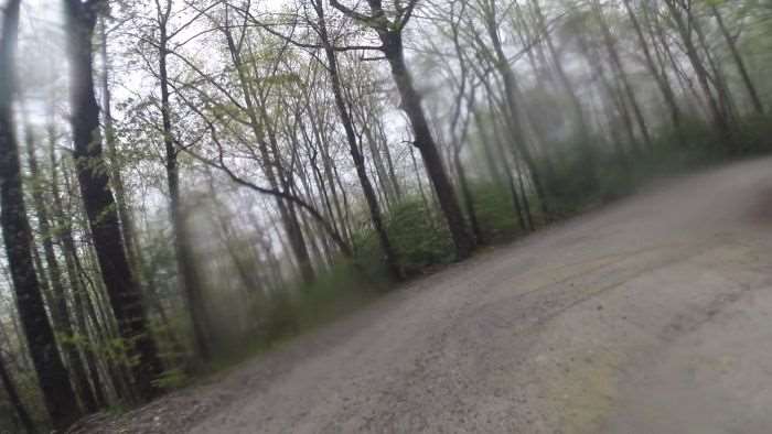 Off the correct line, avoiding heavy ruts on the inside corner.